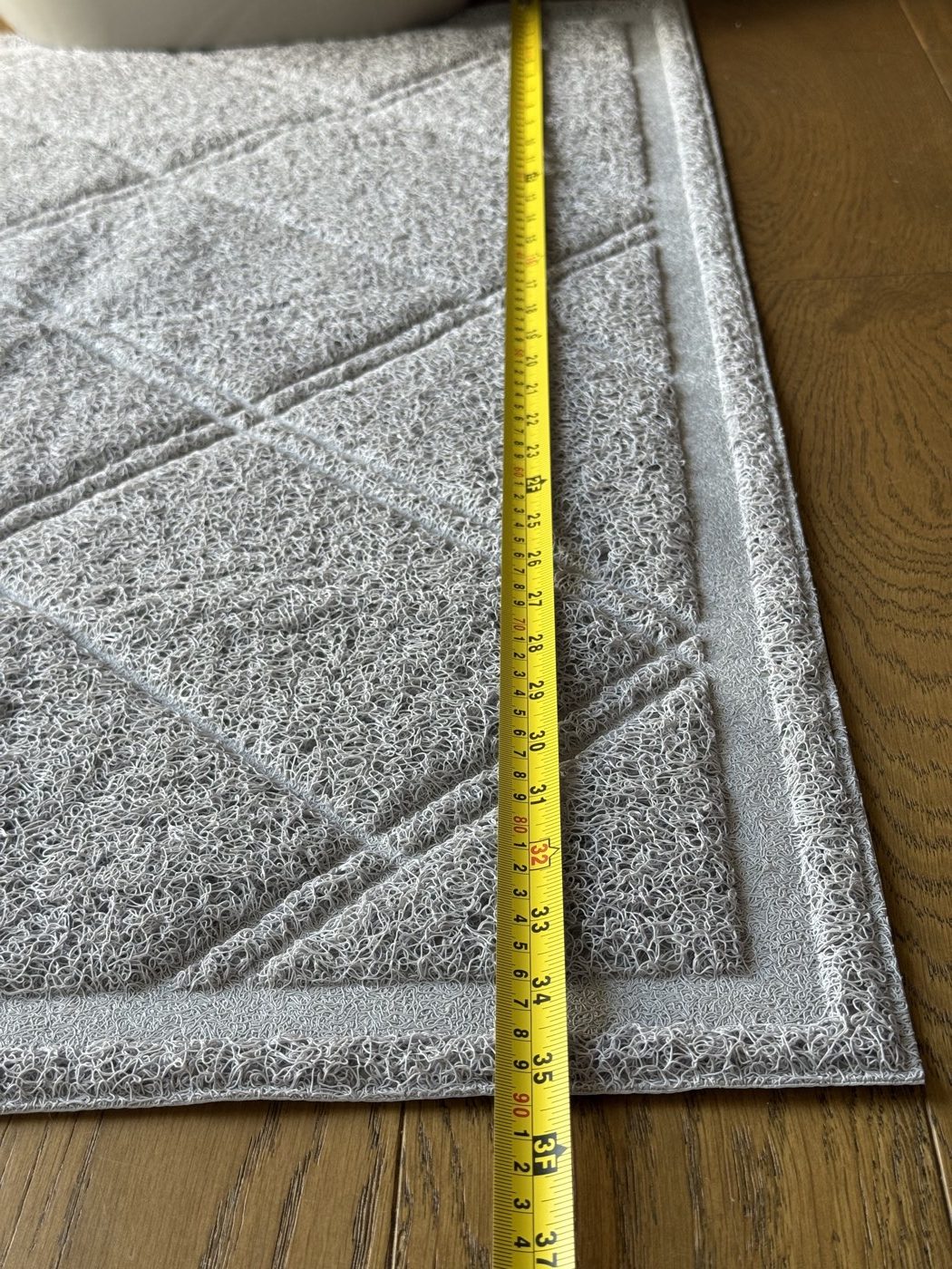 Tape measure along the long edge, about 35 inches